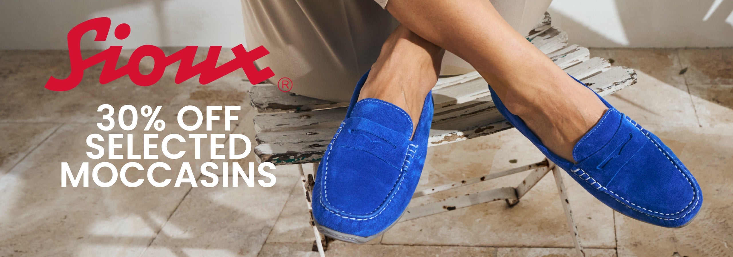 Person wearing blue mocassins with promotional text for 30% off selected Sioux Moccasins.
