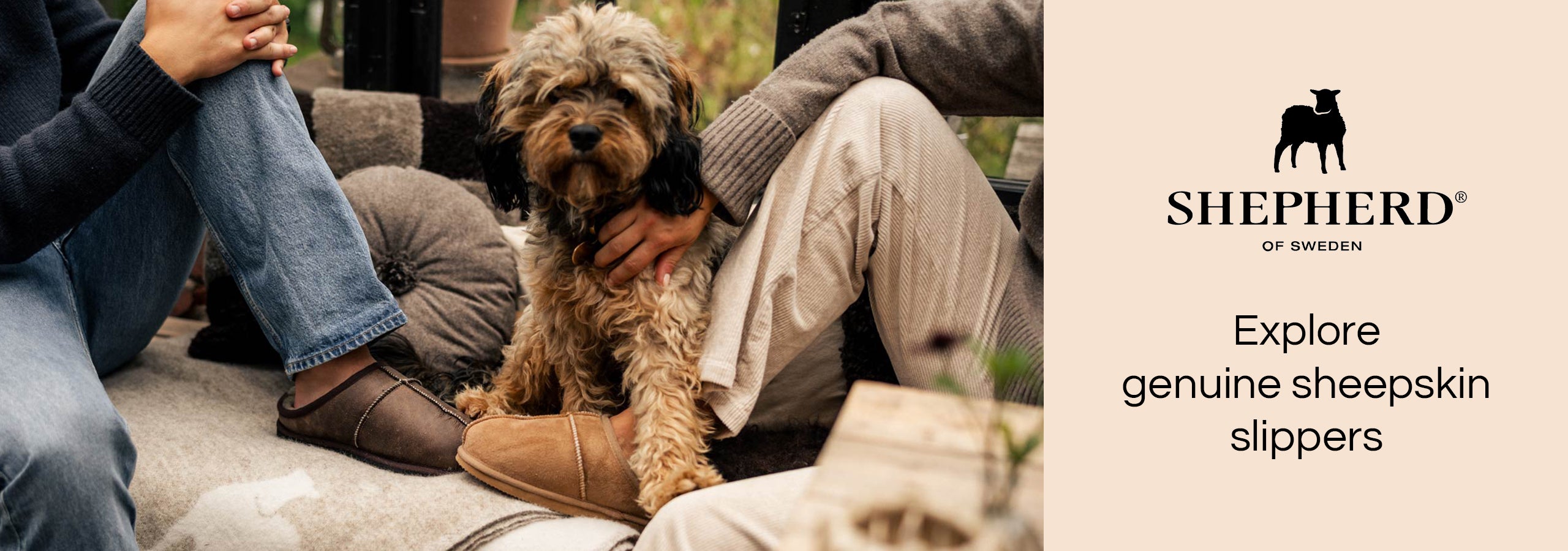 Shepherd of Sweden - explore genuine sheepskin slippers - image of people sat on sofa wearing slippers with dog